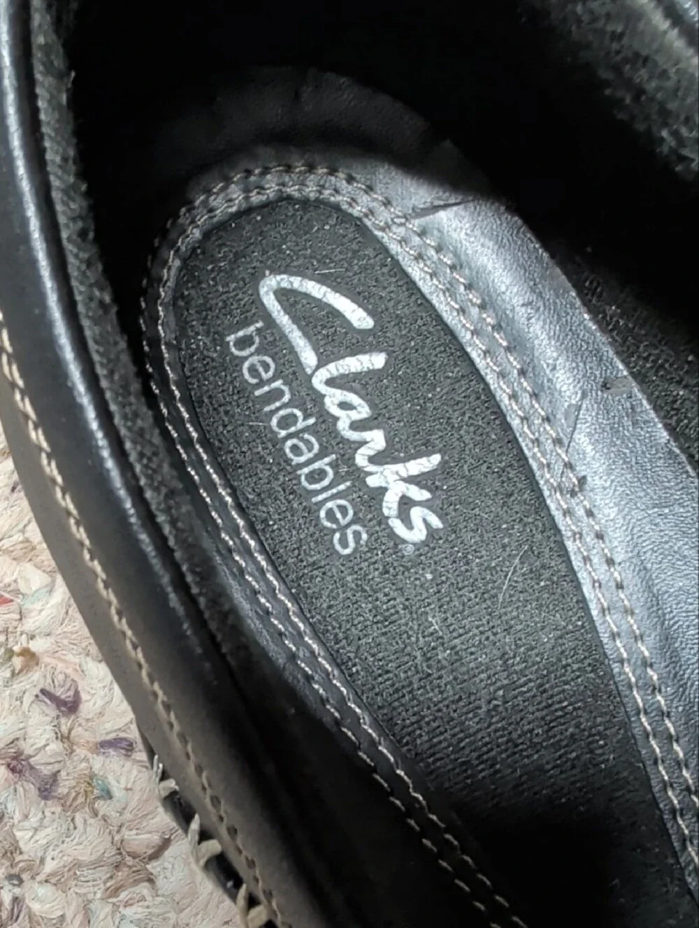 Clarks Black Leather Slip-On Loafers with Contrast Stitching and Button Accent